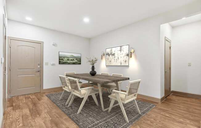 a dining room with a wooden table and chairs