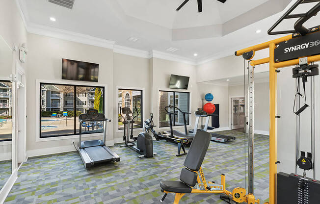 Community Fitness Center with Equipment at Shadow Ridge Apartments in Riverdale, GA.