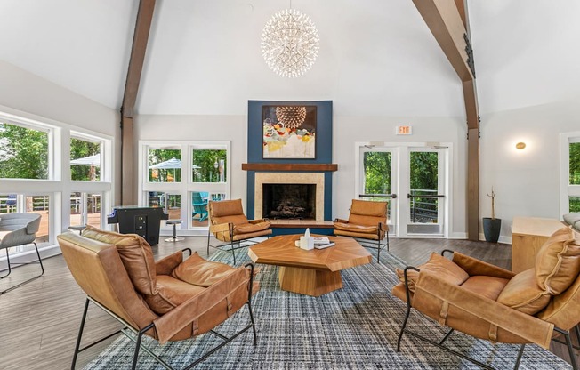 A living room with a fireplace and a chandelier.