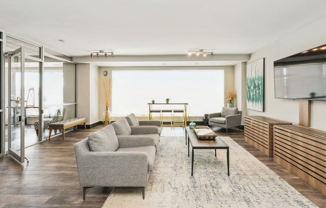 a living room with a couch and a coffee table at The Lafayette Apartments, Colonial Place, Norfolk