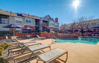 our apartments have a large pool and lounge chairs