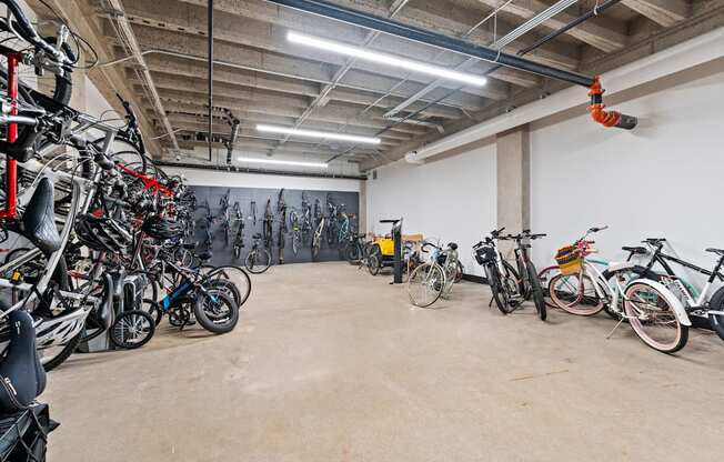 a large room filled with bikes in a garage