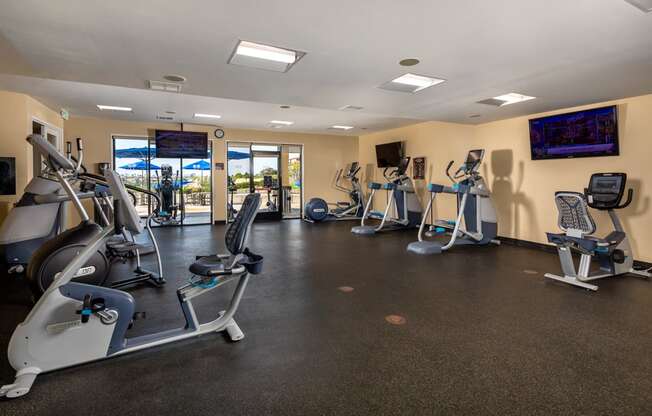 a gym with cardio machines and other exercise equipment