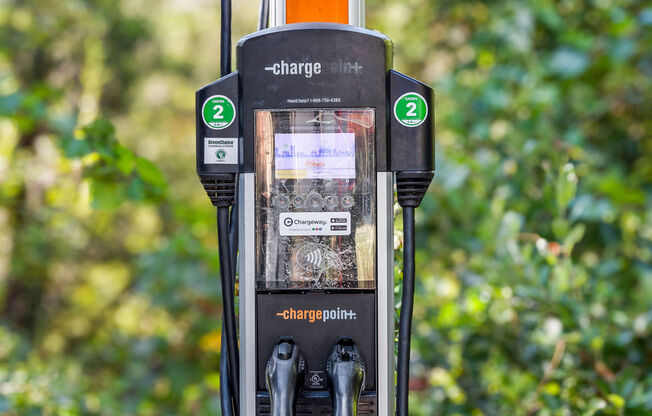 a gas pump with a charge only sign on it