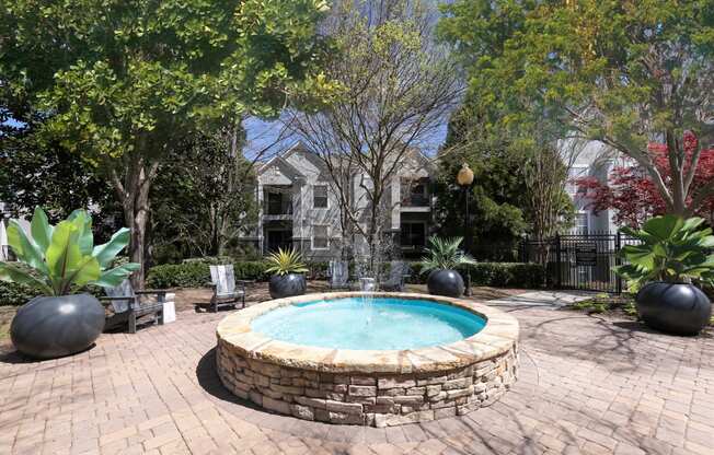 a round swimming pool in a backyard with trees and a house at Deerfield Village, Alpharetta, Georgia