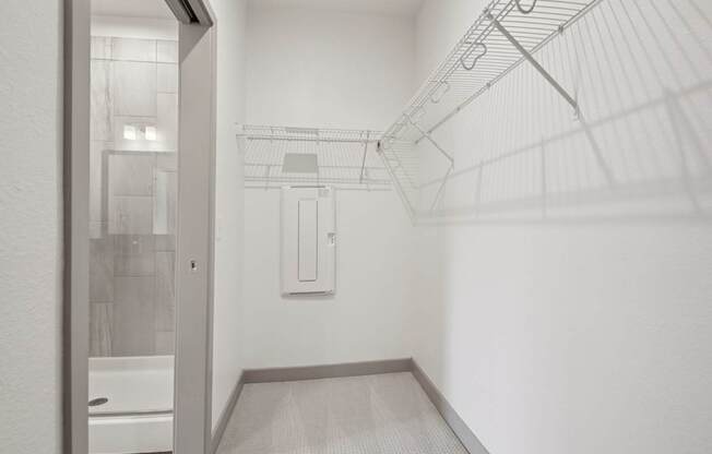 A white bathroom with a walk-in shower.