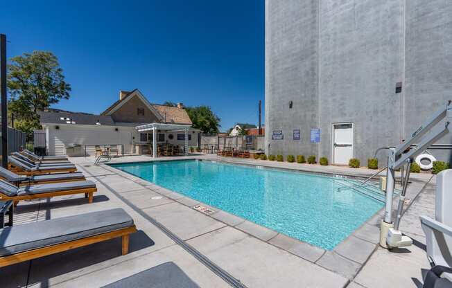 our swimming pool is next to our building at our apartments in the colony