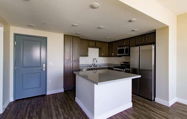 kitchen with a large island in the middle of it at Loma Villas Apartments, San Bernardino, 92408