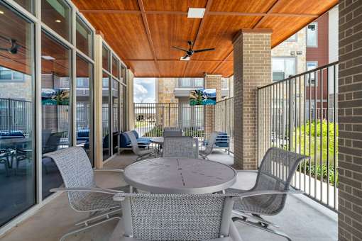 A patio with a table and chairs is shown.