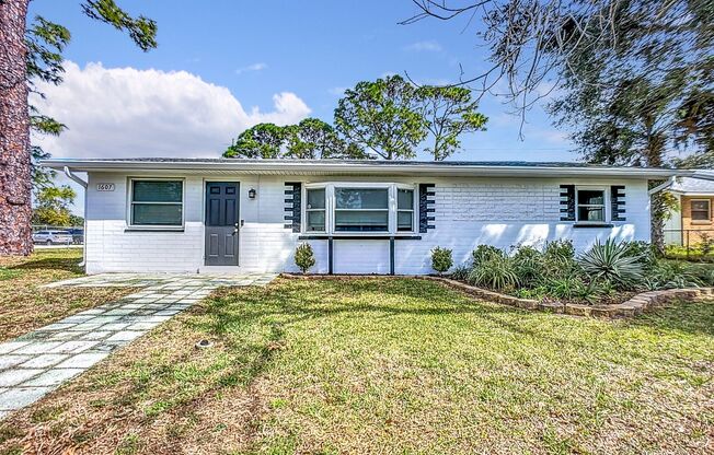 Centrally located in Edgewater, Florida, 3/2 Single Family Home with Large fenced Yard and Storage Shed