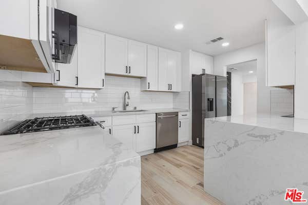 1613 W 209 ST