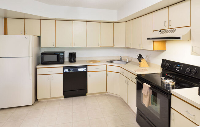 Spacious kitchen with upgraded appliances and ample cabinet and counter space