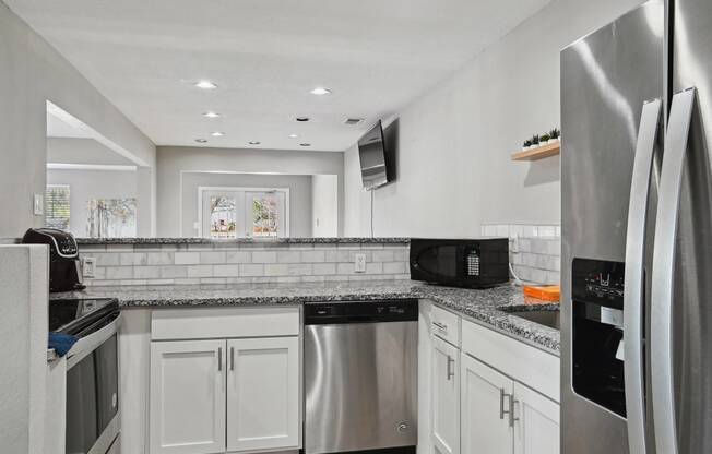 Kitchen with stainless steel appliances and granite counter tops at Emerald Bay, Charlotte