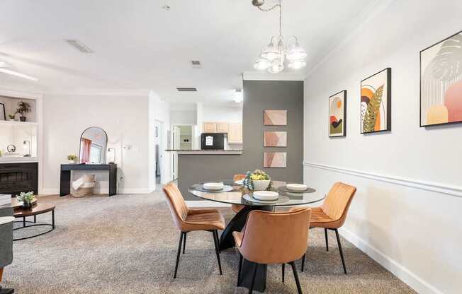 A dining room with a table set for four.