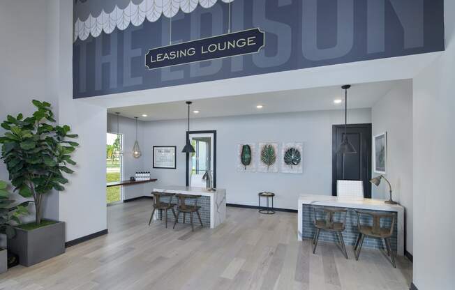 a rendering of the leasing lounge with a long table with chairs and a bar with stools