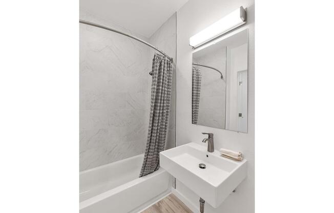 a close up of a sink and a mirror