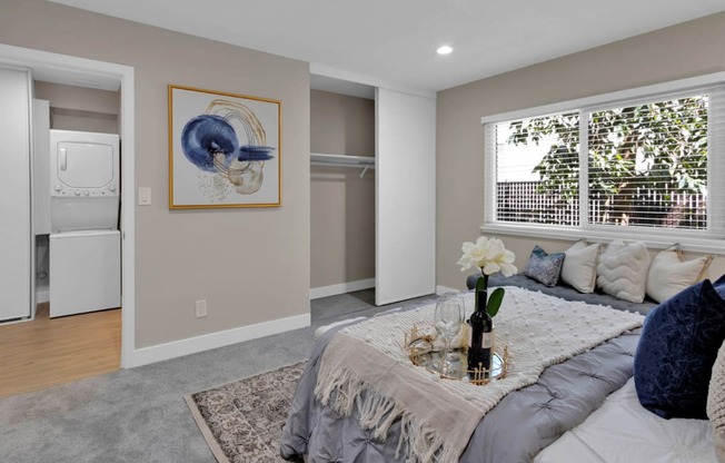 a bedroom with a bed and a window