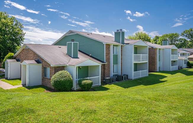 Lush Green Grass in Front of a Rivergate Meadows Apartment Building