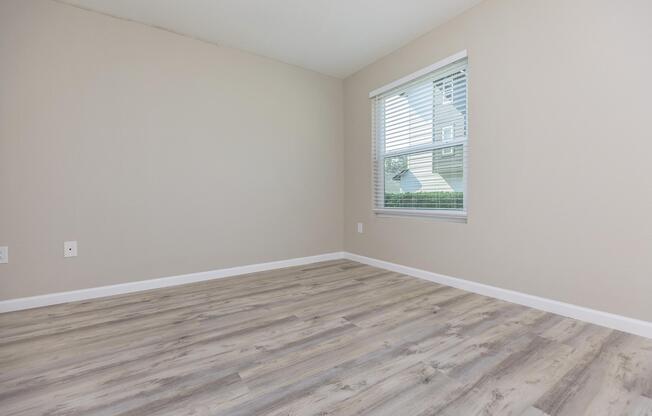 a bedroom with a large window