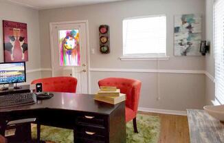a room filled with furniture and a tv on a table