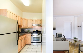 kitchen with stainless steel appliances, wood cabinetry and view of living area at norwood apartments in washington dc