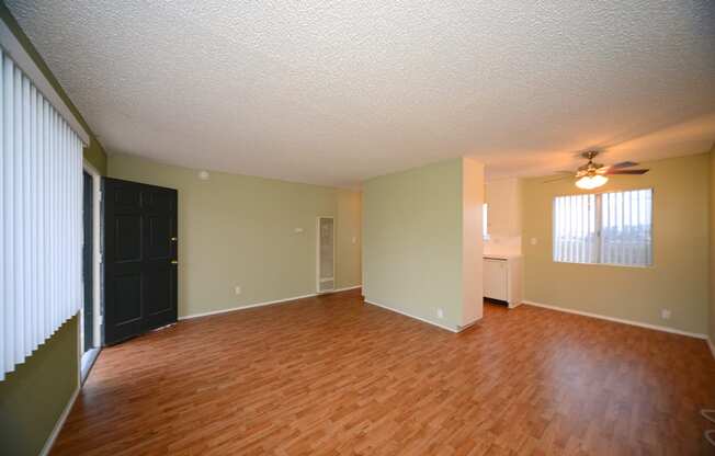 Ocean View Townhomes unfurnished living space with wooden floors full view