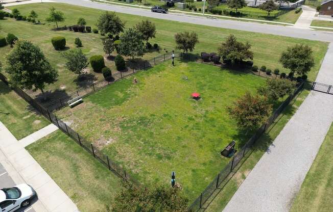 The large fenced in bark park at Fenwyck Manor Apartments in Chesapeake, VA