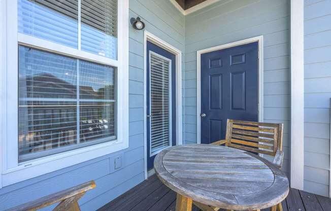 A blue door is on the right side of a white door.