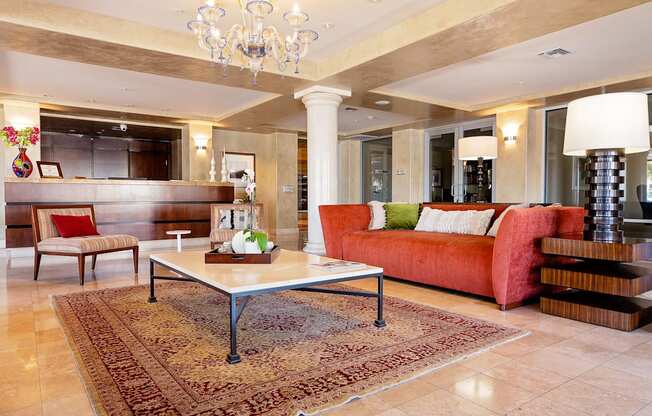 Lobby filled with furniture and a chandelier