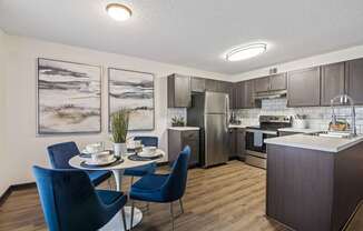 our apartments offer a kitchen and dining room with stainless steel appliances at The Lorient Apartments, Pensacola, FL, 32514