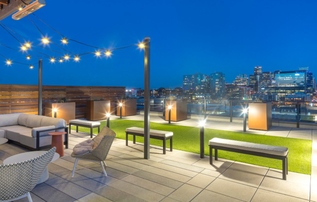 Rooftop deck with lush landscaping, fire pits, outdoor tv, plus city and mountain views