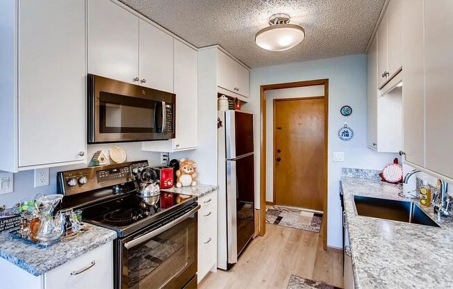 Updated Top-Floor 2 Bedroom Condo with Open Layout, Updated Kitchen & Spacious Balcony