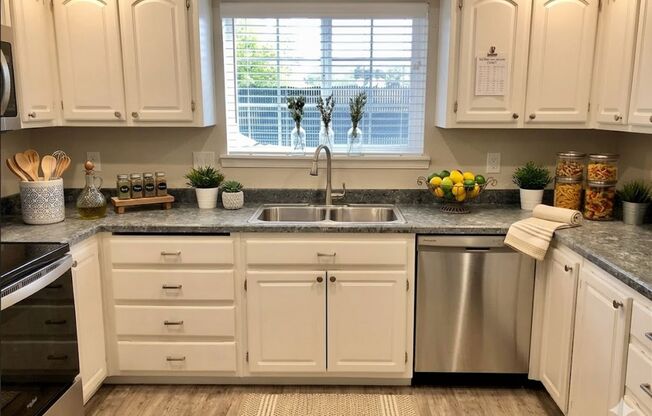 **$500 OFF THE 2ND MONTH'S RENT** Beautifully Remodeled 3 Bedroom Townhome w/ Garage, W/D, Fireplace, and Private Balcony & Patio!