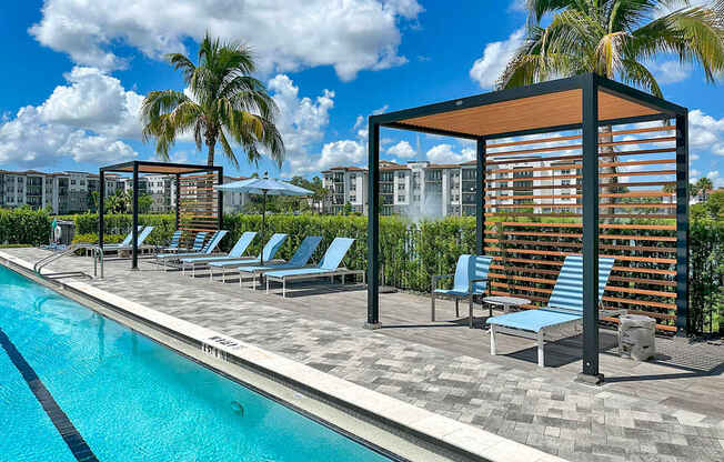 Saltwater pool overlooking private lake with fountains