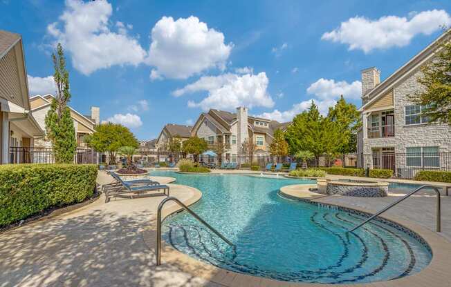 A swimming pool surrounded by a residential area.