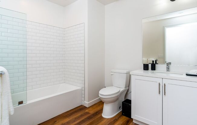 Walk-In Showers With Built-In Bench And Glass Enclosure at Fedora Bliss LLC, Woodland Hills, 91367