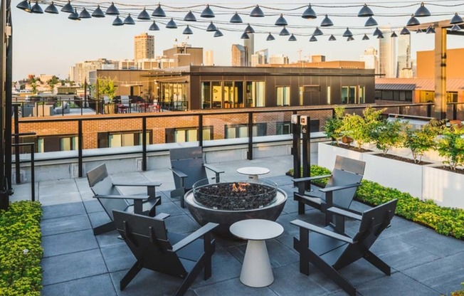 Enjoy the city while sitting around a firepit under twinkling lights at Modera Broadway