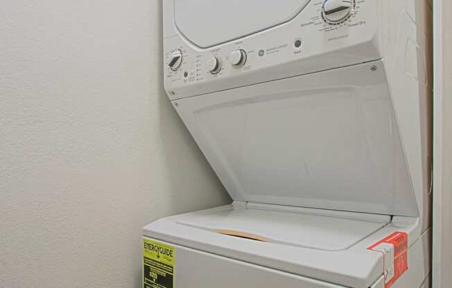 a washer and dryer in the laundry room of an apartment