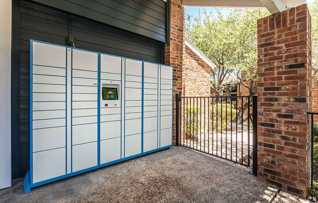 the front of a house with a white garage door and a black gate at Sunset Canyon, San Antonio, 78232