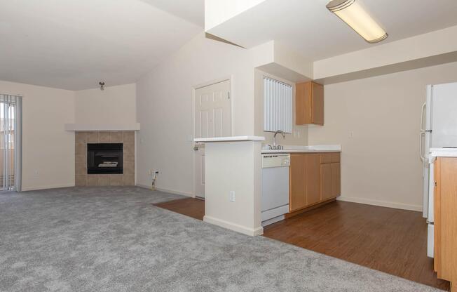 a kitchen with a wood floor in a room