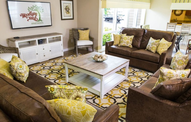 a living room with couches and a coffee table