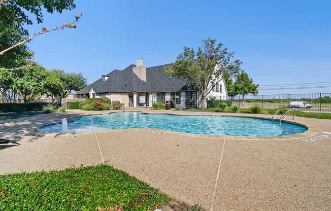 A house with a pool in the backyard.