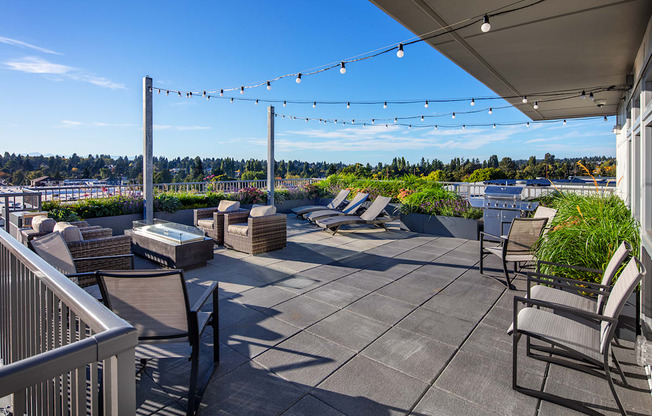 rooftop deck with BBQ and sitting areas