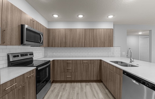 the preserve at ballantyne commons apartment kitchen with stainless steel appliances