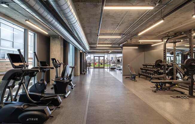 A gym with treadmills and exercise bikes.