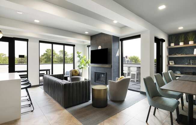 a living room with a fireplace and a table and chairs