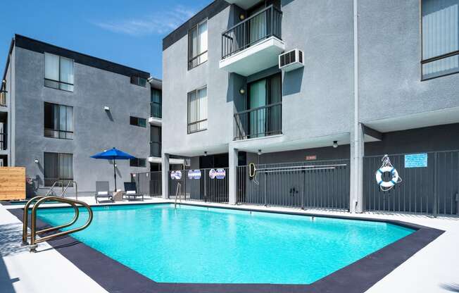 a swimming pool in front of a building