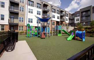 A playground with a slide, swings, and a climbing frame.