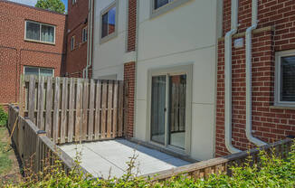 Outdoor patio area connected with apartment unit