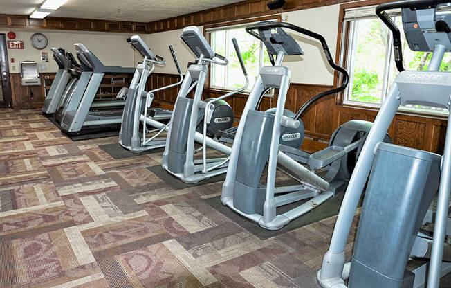 a row of elliptical machines in a fitness room